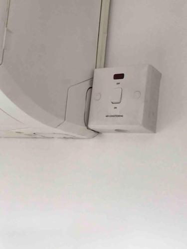 a white router sitting on top of a table at Lovekush Epsom Banstead Surrey. Views over London in Ewell