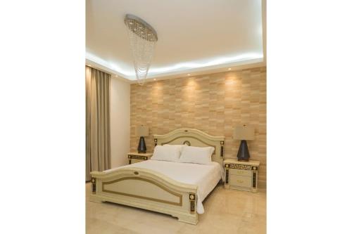 Ένα ή περισσότερα κρεβάτια σε δωμάτιο στο SOHA SUITES II