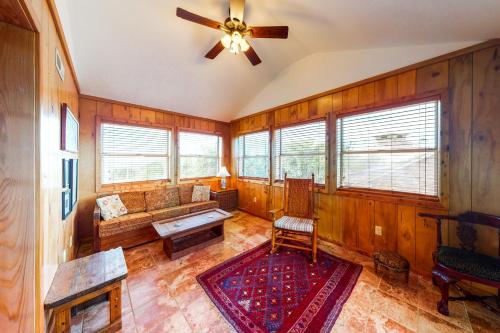 a living room with a couch and a ceiling fan at Pirate's Light #73-B in Buxton