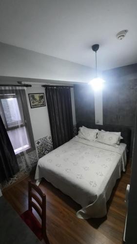 a bedroom with a large bed and a window at Galata Life Istanbul in Istanbul