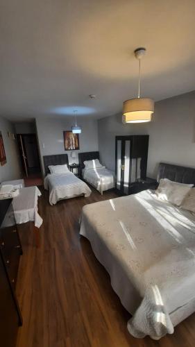 a large bedroom with three beds in it at Galata Life Istanbul in Istanbul