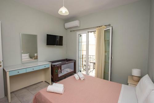 Ένα ή περισσότερα κρεβάτια σε δωμάτιο στο Villa Kondraki
