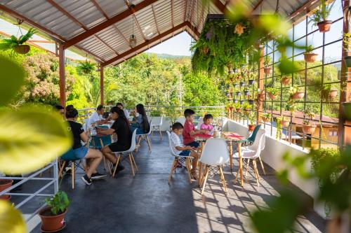 a group of people sitting at a table in a restaurant at Fanda in Sauce