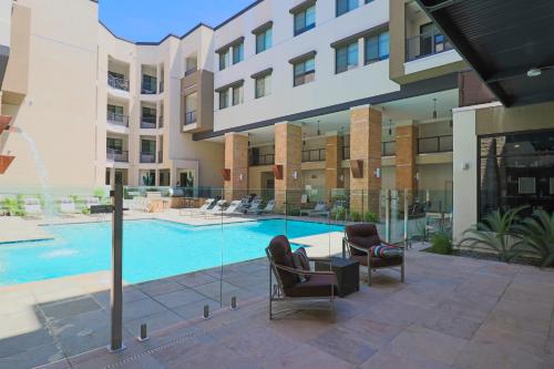 a swimming pool in the middle of a building at Walk Score 81-Shopping District-King Bed-Parking - G4004 in Scottsdale