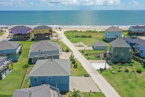 an aerial view of a beach with houses and the ocean at Ohana home in Crystal Beach