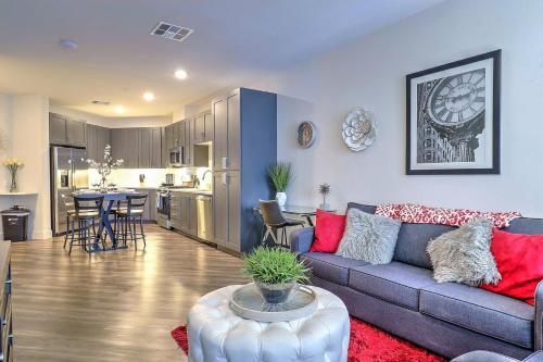 a living room with a couch and a table and a kitchen at Work in Style w Private Workspace and Premium Comfort - G2047 in Scottsdale