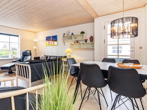 a dining room with a table and chairs at 8 person holiday home in Skagen-By Traum in Skagen