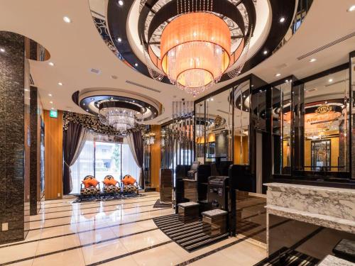 a lobby of a building with a chandelier at APA Hotel Asakusa Kuramae Ekimae in Tokyo