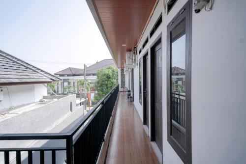an empty balcony with a view of a building at RedDoorz @ Jalan Urip Sumoharjo Lampung in Kedaton