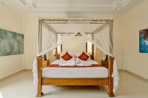 Ένα ή περισσότερα κρεβάτια σε δωμάτιο στο Gora House Bali
