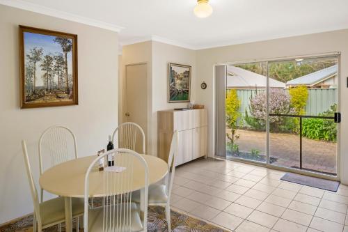 a kitchen and dining room with a table and chairs at Prowse Pad in Dunsborough