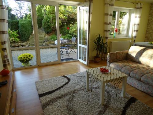 a living room with a couch and a table at Ferienwohnung Findus in Haldenwang