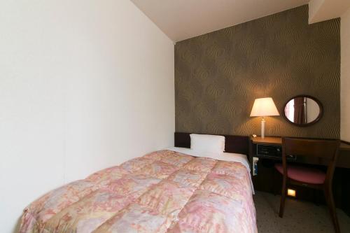 Cama o camas de una habitación en Hotel Econo Kanazawa Station