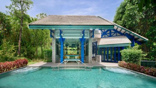 a house with a swimming pool with a gazebo at InterContinental Khao Yai Resort, an IHG Hotel in Mu Si