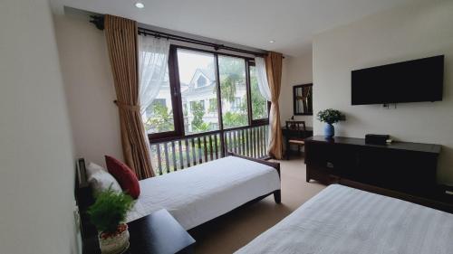 Ένα ή περισσότερα κρεβάτια σε δωμάτιο στο Sunny Hut Villa - Phu Quoc