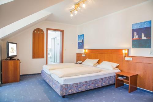 Postel nebo postele na pokoji v ubytování Hotel Heide Residenz