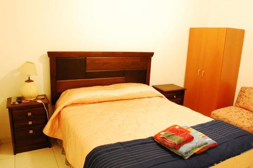 Cama ou camas em um quarto em Hostal Portales