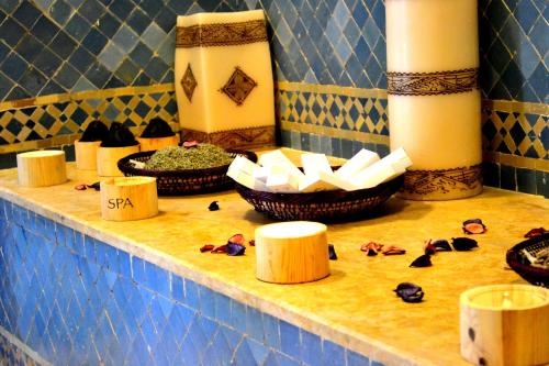 a counter with bowls of spices and candles on it at Casablanca Le Lido Thalasso & Spa (ex Riad Salam) in Casablanca