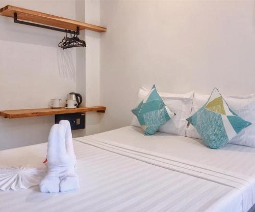 Postel nebo postele na pokoji v ubytování Palmera El Nido Inn