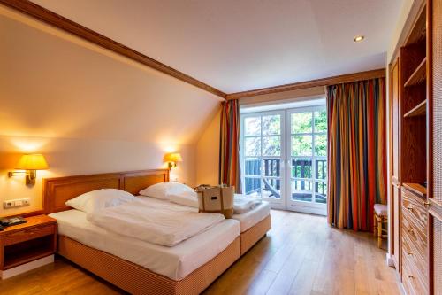 Postel nebo postele na pokoji v ubytování Hotel Landhaus Höpen