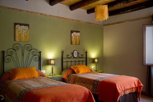 Un pat sau paturi într-o cameră la Finca la Colorá