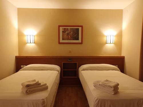 Cama o camas de una habitación en Hotel Estel