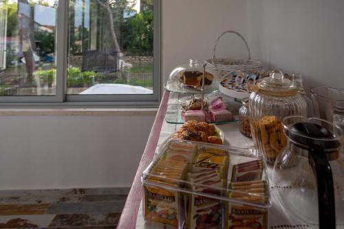 a table with some pastries and food on it at b&b RetrO'Conero in Castelfidardo