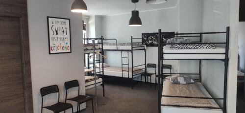 a room with a bunch of bunk beds at Hostel Sunrise przy DW. Zachodnim in Warsaw