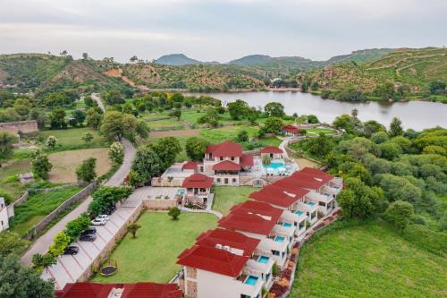 an aerial view of a resort with a lake at Sarasiruham Resort - Private Pool Villa in Udaipur in Udaipur