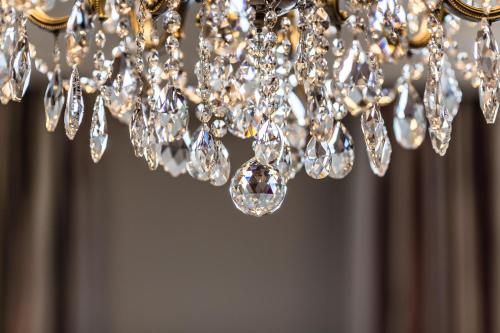 a close up of a chandelier with diamonds at Fairmont Hotel Vier Jahreszeiten in Hamburg