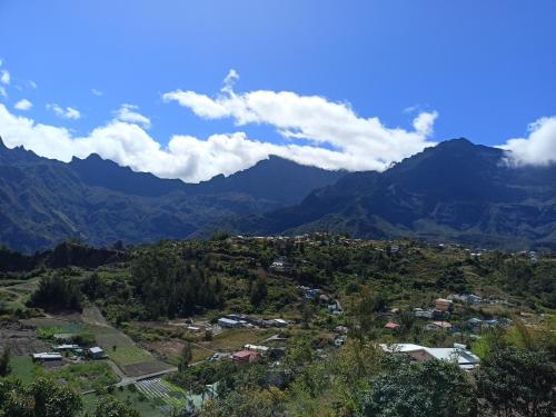 a town in a valley with mountains in the background at Petite Fleur de Lentilles 2 in Cilaos