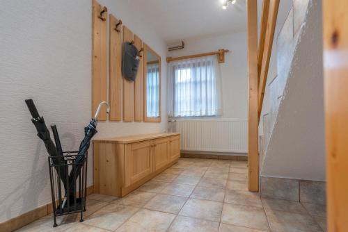 a kitchen with a counter and an umbrella on the floor at Chalet Ajda in Bohinj