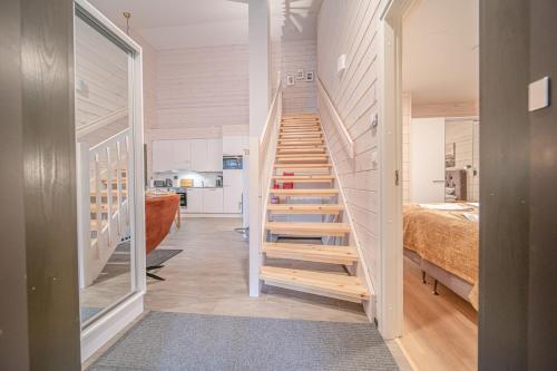 a staircase leading to a bedroom in a house at Levillas Sointuilevi 1 B67, 2 ski pass included in Levi