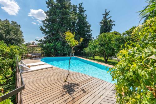 an image of a swimming pool with a wooden deck at Sencelles - 3998-03 Mallorca in Sencelles