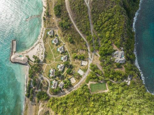 an aerial view of an island next to the ocean at The Liming Bequia in Friendship
