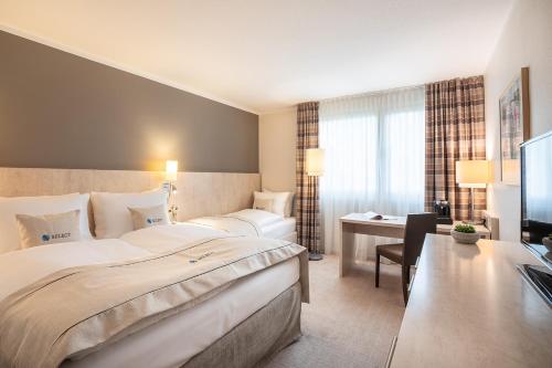 Кровать или кровати в номере Select Hotel Mainz