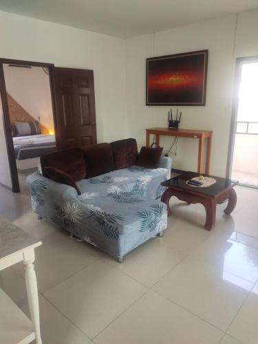 a living room with a couch and a coffee table at Wirason villa 2BR in Koh Samui 