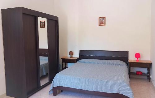 Postel nebo postele na pokoji v ubytování B&B Il Cortile del Sole