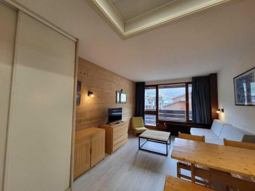 a living room with a couch and a table at Studio cosy sud-ouest proche pistes avec balcon - 4 pers - FR-1-449-117 in Tignes