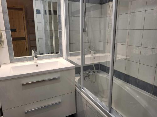 a bathroom with a shower and a sink and a tub at Studio cosy sud-ouest proche pistes avec balcon - 4 pers - FR-1-449-117 in Tignes