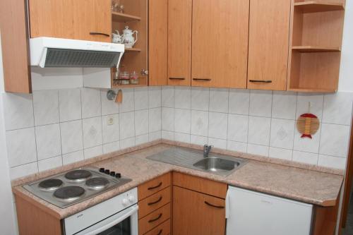 a kitchen with a sink and a stove at Apartment Bol 2884b in Bol