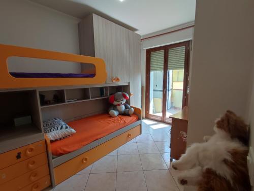 a bedroom with a bunk bed with a teddy bear on it at Appartamento di Durante Achille trilocale di 80 mq in Arezzo