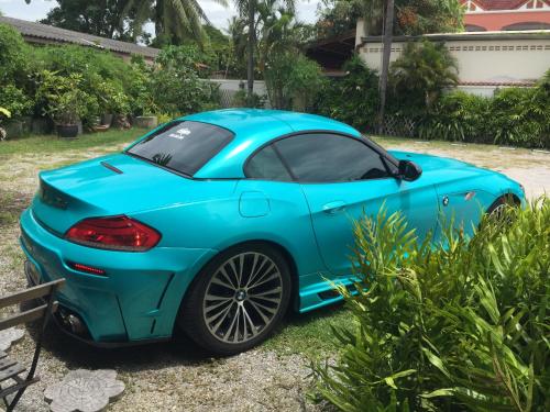 a blue sports car parked in a yard at BC Summer Beach in Pran Buri