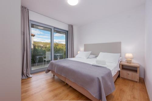 Postel nebo postele na pokoji v ubytování Rooms & Apartments Niko