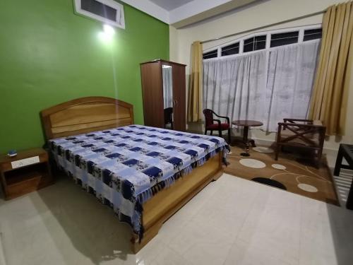 Postel nebo postele na pokoji v ubytování Odyssey Stays Jowai - West Jaintia Hills