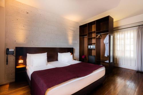 a bedroom with a large bed in a room at Palla Boutique Hotel in Arequipa