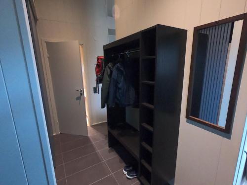 a black dresser in a room with a hallway at Viste Funäsdalen in Funäsdalen