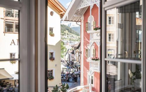 a view of a city from a window at Classic Hotel Am Stetteneck in Ortisei