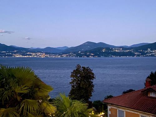 a view of a large body of water with mountains at Casa Doris in Oggebbio