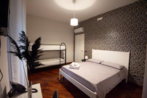 a bedroom with a bed and bunk beds in it at DONNA ROSITA in San Felice a Cancello